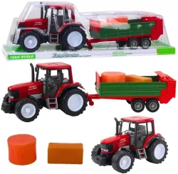 Traktor rolniczy z przyczepą zieloną