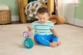 Fisher-Price Fioletowa Małpka Piłeczka - tantis.pl